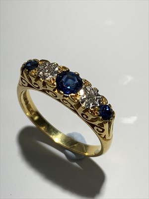 Lot 2420 - An 18ct gold Victorian style ring set with two...