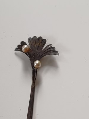 Lot 681 - Fourteen various Japanese metal, jade and hardstone kanzashi and kogai, 19th/20th century.