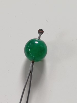 Lot 681 - Fourteen various Japanese metal, jade and hardstone kanzashi and kogai, 19th/20th century.