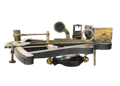 Lot 288 - An ebony and brass octant.