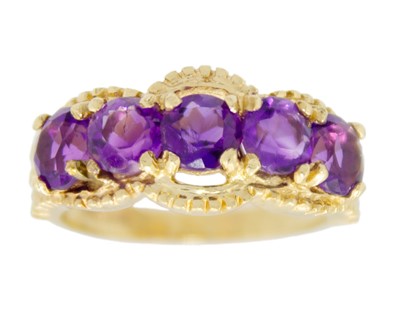 Lot 8 - A 14ct amethyst set five stone ring.