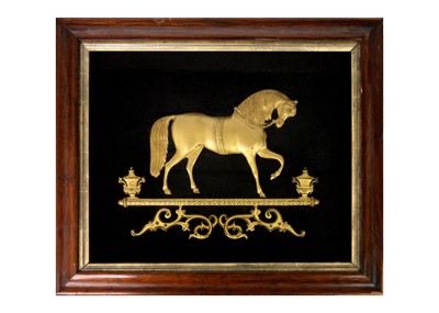 Lot 35 - A Victorian gilt metal relief picture of a horse.