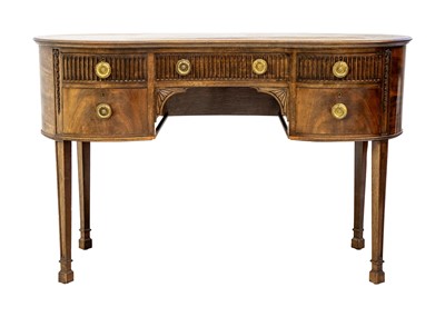 Lot 950 - A George III style mahogany kidney shaped desk.