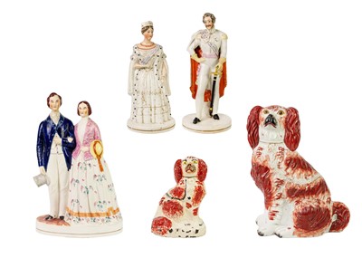 Lot 1193 - A pair of Staffordshire pottery figures of Queen Victoria and Prince Albert.