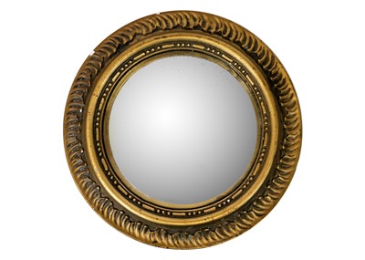 Lot 494 - A Circular gilt plaster convex wall mirror.