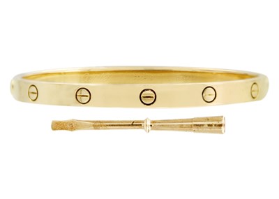 Lot 23 - CARTIER - An 18ct love bangle with a screwdriver and original box and bag.