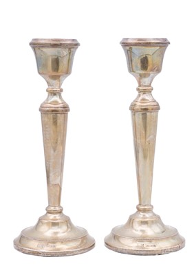 Lot 51 - A pair of silver candlesticks by A T Cannon Ltd.