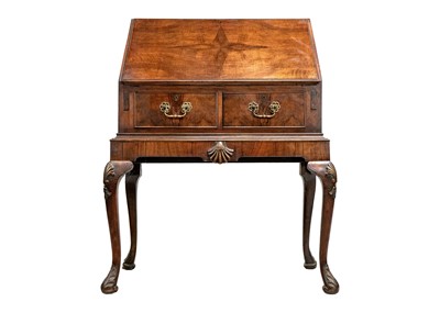 Lot 635 - An early 20th Century walnut bureau.