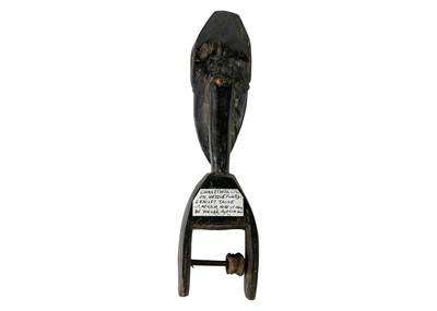 Lot 182 - A Senofu carved heddle pulley.
