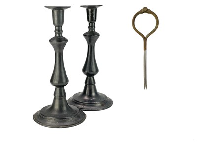 Lot 125 - A pair of Georgian style pewter baluster candlesticks.