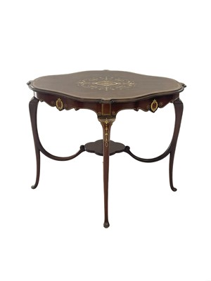 Lot 596 - A mid century Italian walnut quatrefoil centre table with bone and fruitwood inlay.