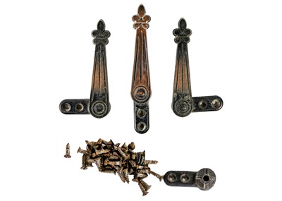 Lot 76 - A set of twenty-four early 20th century copper plated stair carpet grips of fleur-de-lys design.