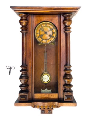 Lot 576 - A German Kienzle walnut cased wall clock.