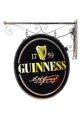 Lot 34 - A large circular Guinness advertising sign.