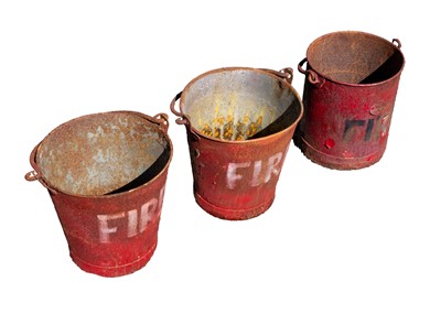 Lot 56 - Three red painted metal 'FIRE' buckets.
