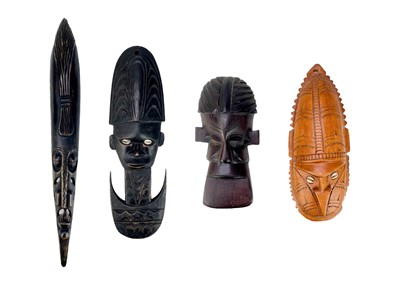 Lot 206 - Four Oceania carved masks.