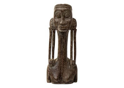 Lot 183 - An Oceania wood carved figure with an elongated neck and lobe gauged ears.