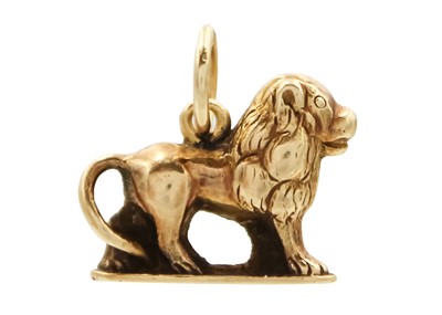 Lot 35 - A high purity gold (tests 18ct) lion charm pendant.