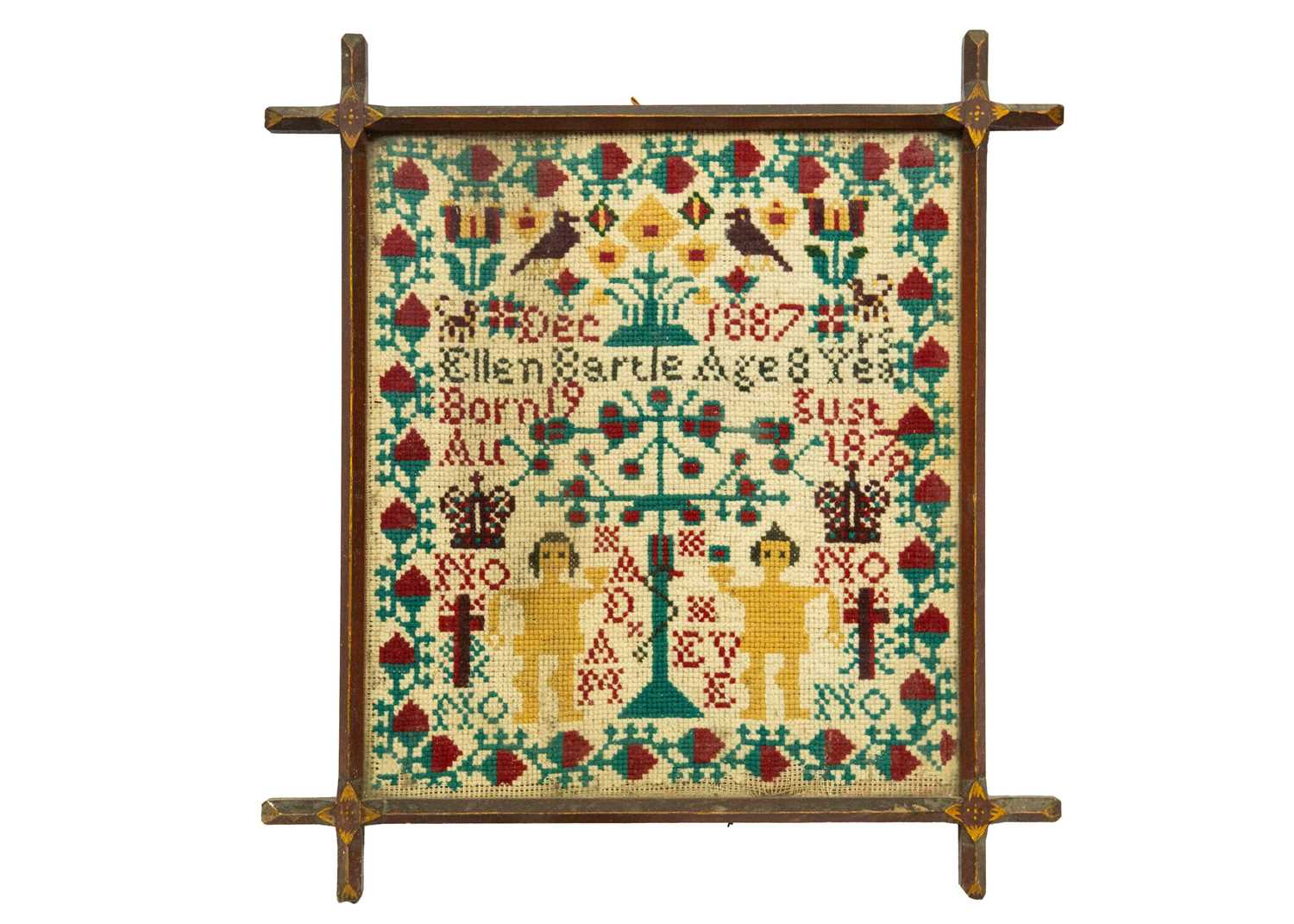 Lot 1592 - A Victorian cross stich wool work sampler.