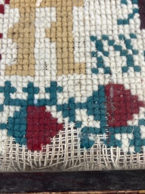 Lot 1592 - A Victorian cross stich wool work sampler.