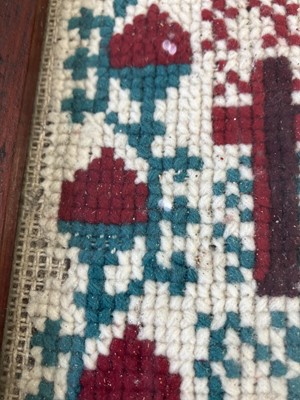 Lot 1592 - A Victorian cross stich wool work sampler.