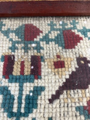 Lot 1592 - A Victorian cross stich wool work sampler.