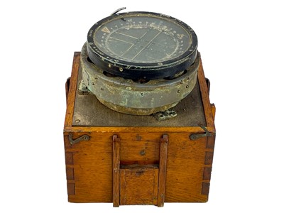 Lot 302 - A WWII oak cased Air Force compass.
