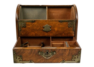 Lot 71 - An Edwardian oak dome top smokers compendium.