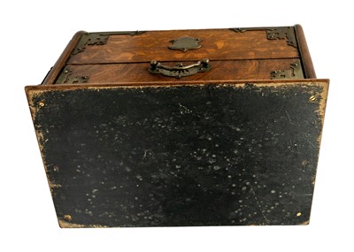 Lot 71 - An Edwardian oak dome top smokers compendium.