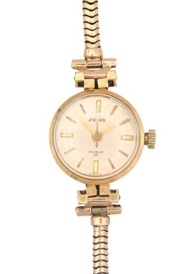 Lot 145 - ENICAR - An Incabloc 25 lady's 18ct cased manual wind wristwatch with 9ct gold bracelet.