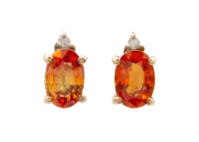 Lot 49 - A pair of orange sapphire and diamond set 9ct rose gold earrings.