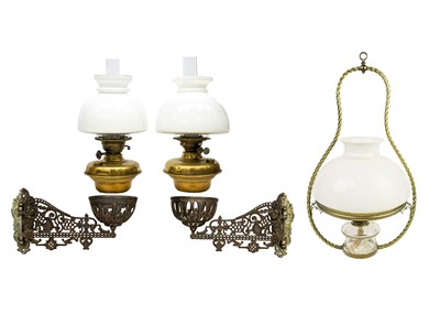 Lot 166 - A pair of late Victorian Aesthetic movement cast iron and brass oil wall lights.