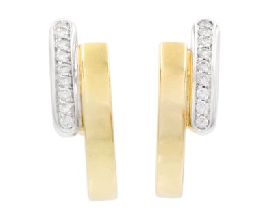 Lot 52 - An 18ct yellow and white gold diamond set pair of stud and clip back earrings.