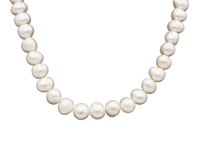 Lot 56 - An impressive string of large white cultured pearls with 9ct ball clasp.