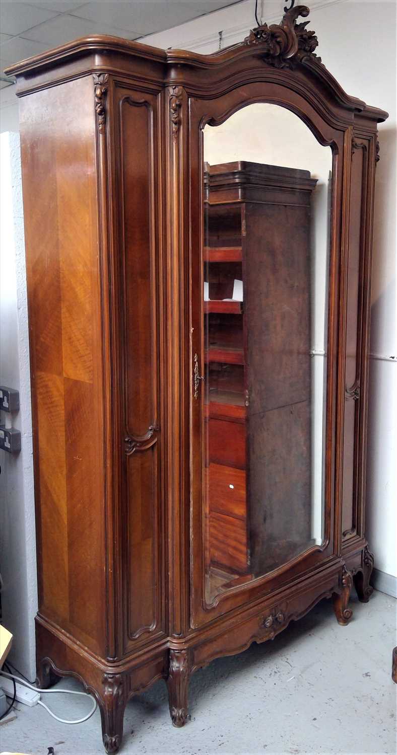 Lot 3520 - A French walnut armoire, 20th century, with a...