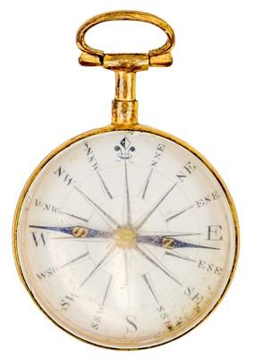 Lot 308 - An early 19th century gilt brass compass with enamel dial and blue steel needle.