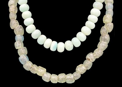 Lot 301 - A green jadeite bead necklace with 925 silver clasp.