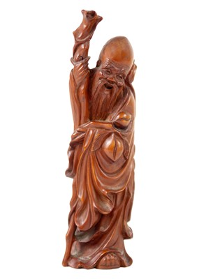 Lot 1122 - A Chinese carved wood figure of Shoulao.