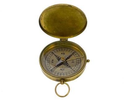 Lot 320 - A brass dip needle compass.