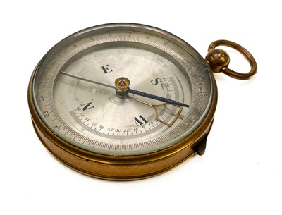 Lot 320 - A brass dip needle compass.