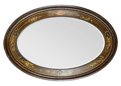 Lot 249 - An Edwardian Chinoiserie lacquered oval wall mirror.