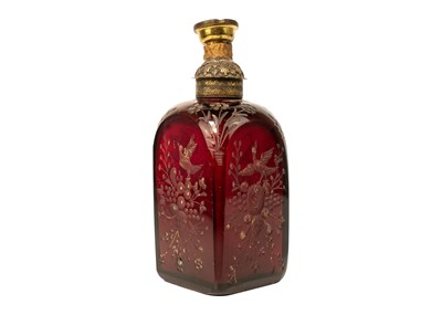 Lot 332 - An early 18th century ruby glass decanter, etched with exotic birds, flowers and foliage.