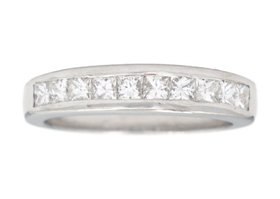 Lot 81 - An 18ct white gold diamond set half eternity ring.