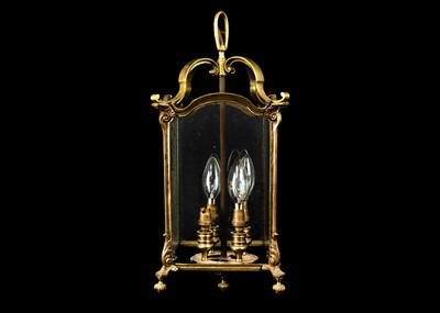 Lot 1611 - A brass four light hall lantern.