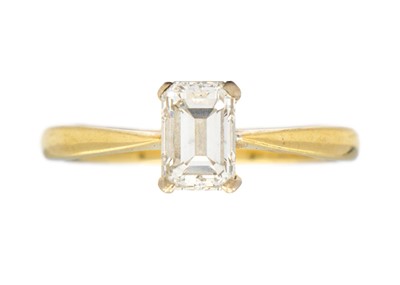 Lot 185 - A modern 18ct emerald cut diamond solitaire ring.