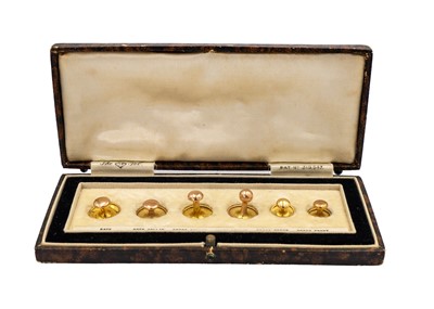 Lot 87 - A 9ct cased set of six dress shirt studs inscribed 'The OP set'.