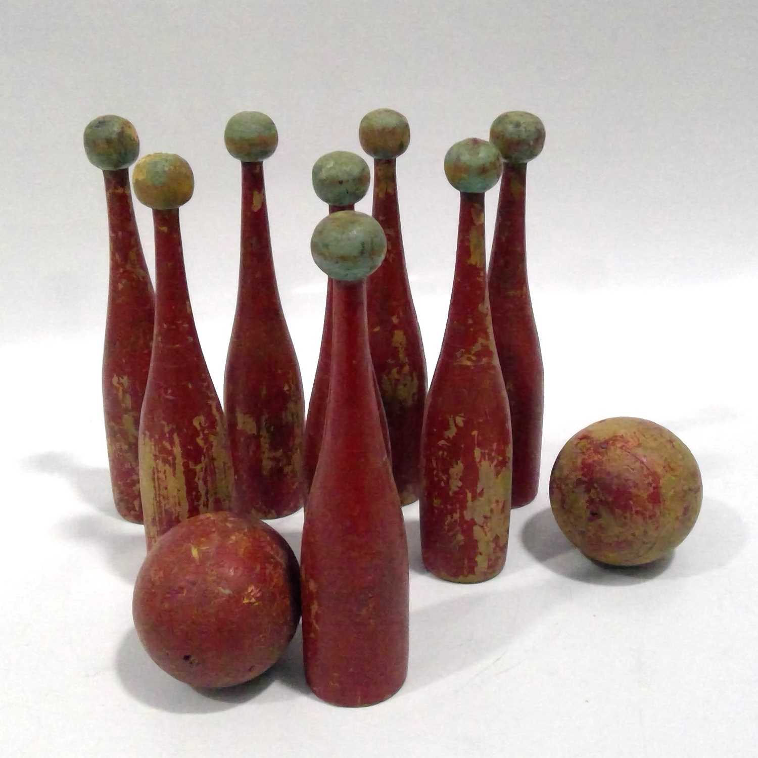 Lot 172 - A set of eight vintage wooden Skittles with