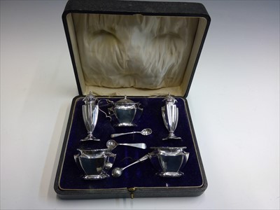 Lot 2000 - An Art Nouveau five piece cruet with spoons...