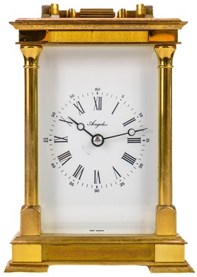 Lot 564 - An Angelus brass carriage clock.