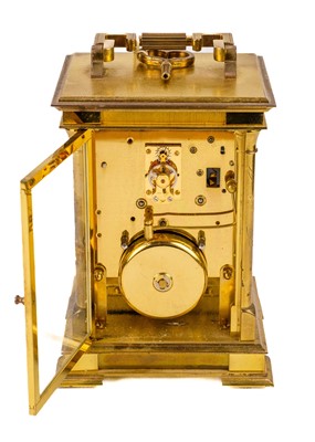 Lot 564 - An Angelus brass carriage clock.